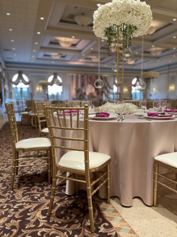 Gold Chiavari chairs at a wedding